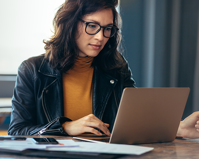 A woman is working with modern technologies 