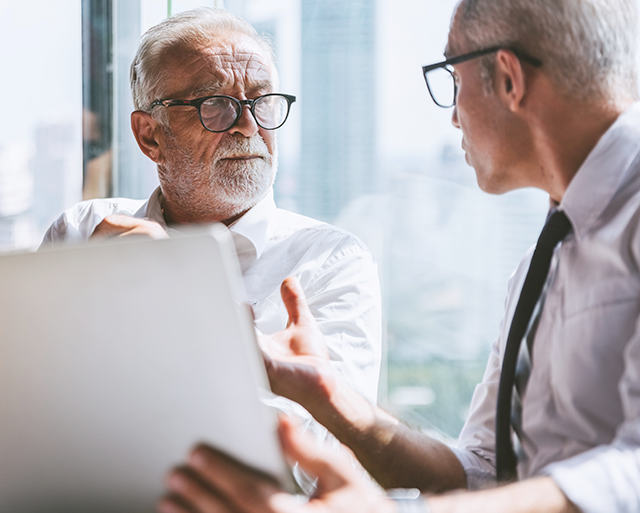 Two business people are speaking about data