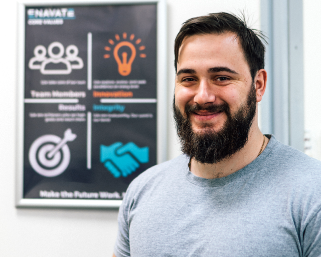 Enavate Intern is staying near the core values banner